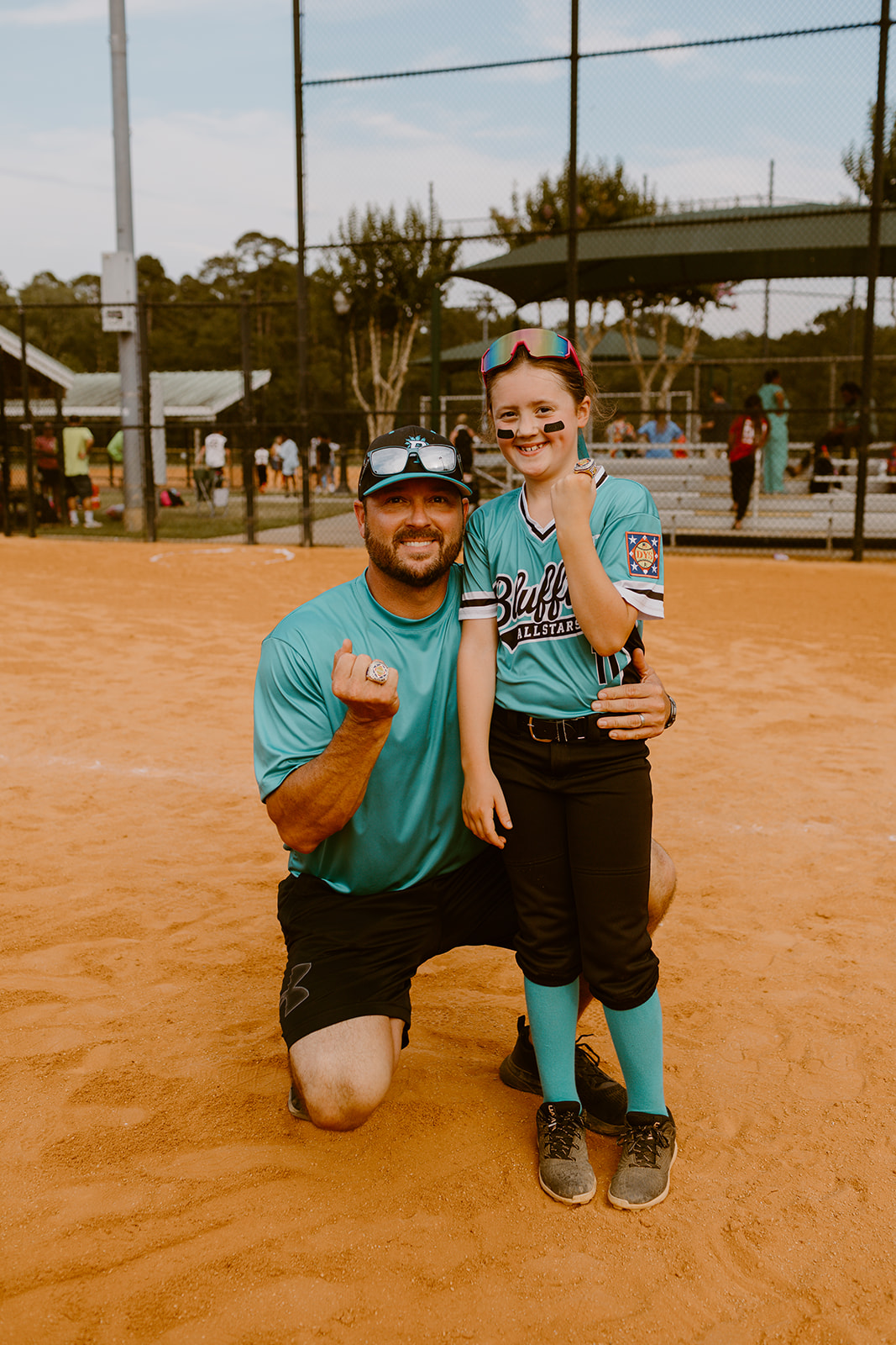 Bluffton All-Star player celebrating with her coach on the softball field